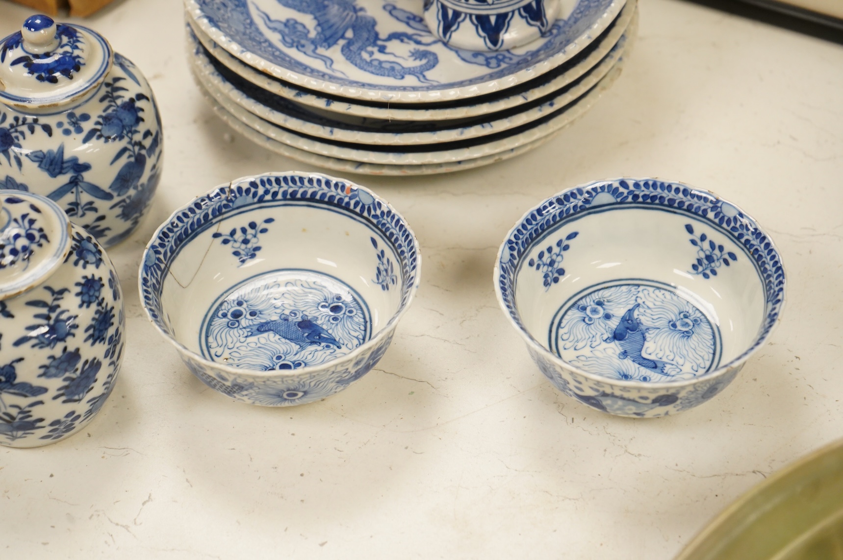 Group of blue and white Chinese porcelain and pottery to include dragon dishes and a pair of fish bowls, together with a pair of tin glazed vases, largest 21cm in diameter
